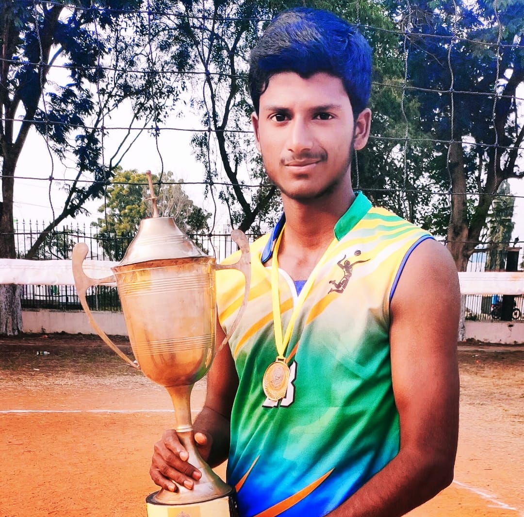 Purna holding the winners trophy and medal at the 24th State Level Inter Polytechnic Sports and Games Meet